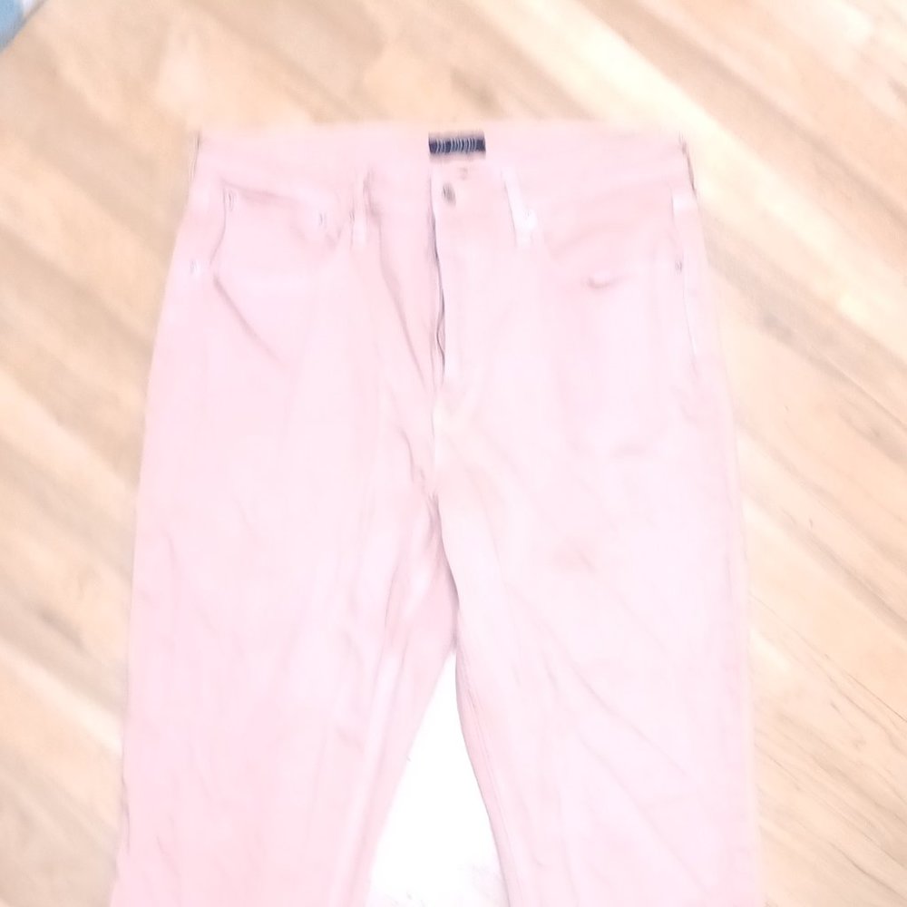 Light pink boot leg jeans.